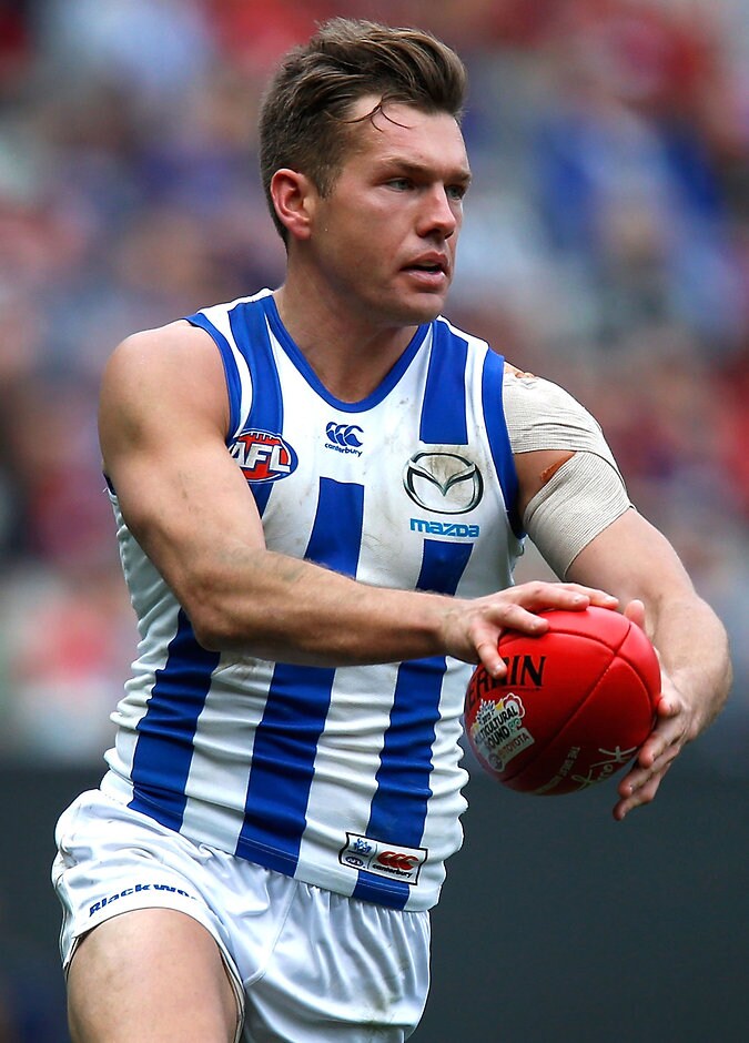 AFL 2015 Rd 19 - Melbourne v North Mebourne MELBOURNE, AUSTRALIA - AUGUST 9: Shaun Higgins of the Kangaroos in action during the 2015 AFL round 19 match between the Melbourne Demons and the North Melbourne Kangaroos at the Melbourne Cricket Ground, Melbourne, Australia on August 9, 2015. (Photo by Adam Trafford/AFL Media)